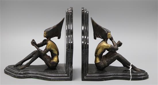 After Lorenzl. A pair of bronzed metal marble bookends height 20cm